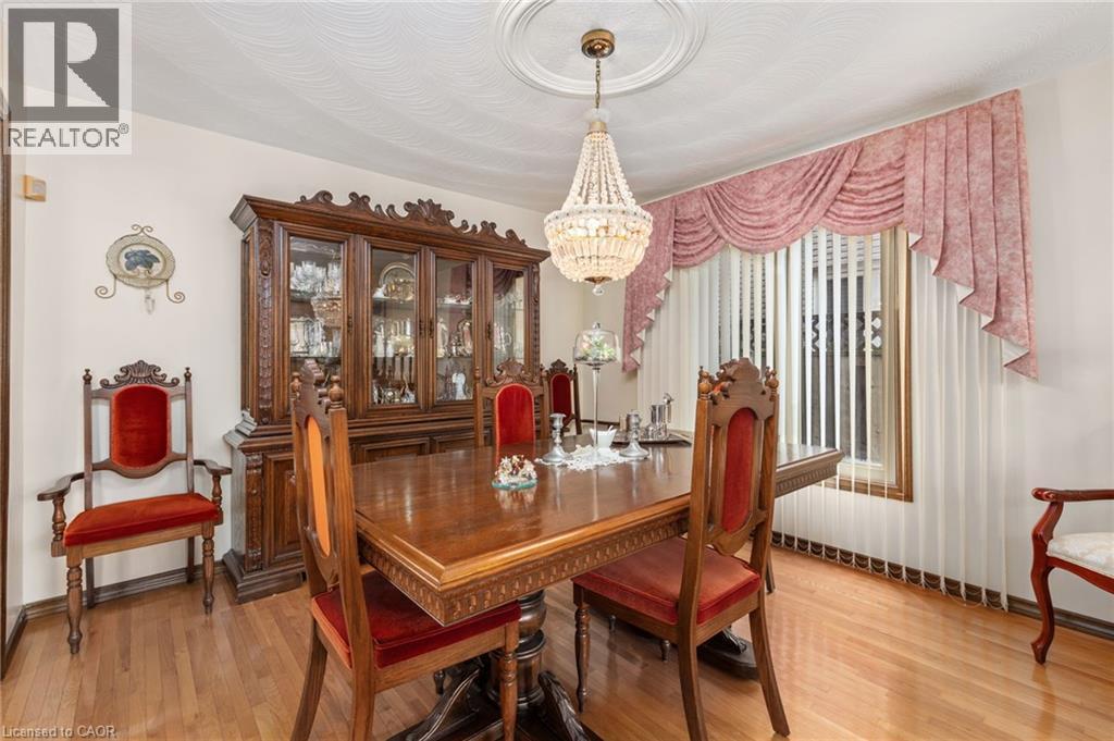 Dining room featuring suspended lighting and light wood-type flooring - 57 Derek Drive, Hamilton, ON - Indoor Photo Showing Dining Room