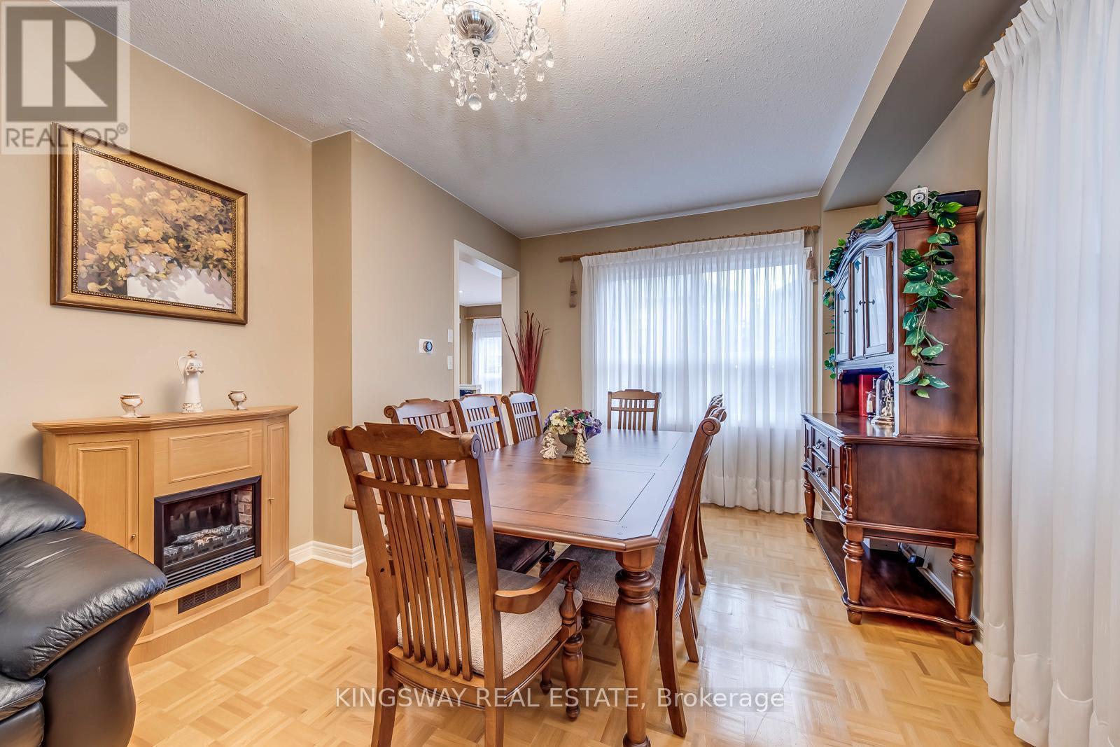 5829 Yachtsman Crossing, Mississauga, ON - Indoor Photo Showing Dining Room With Fireplace