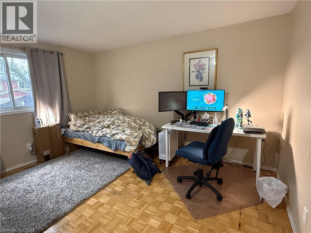Bedroom with parquet flooring and a desk - 60 Helene Crescent, Waterloo, ON - Indoor Photo Showing Bedroom