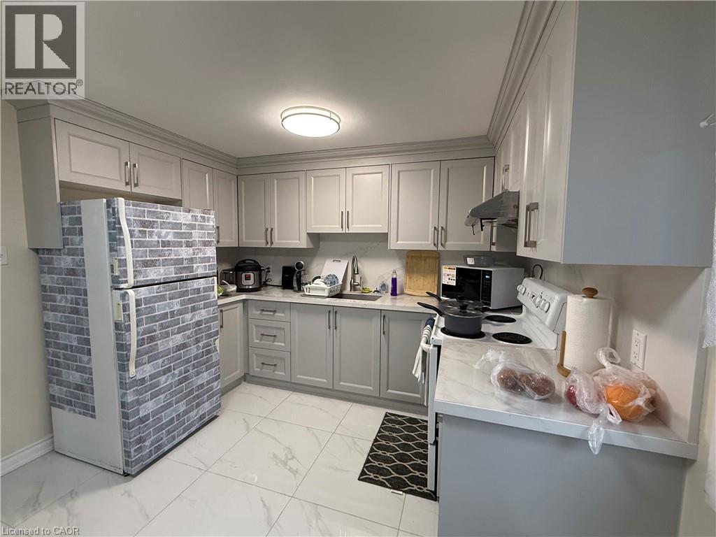 Kitchen featuring gray cabinetry, freestanding refrigerator, light marble finish flooring, electric range, and black microwave - 60 Helene Crescent, Waterloo, ON - Indoor Photo Showing Kitchen