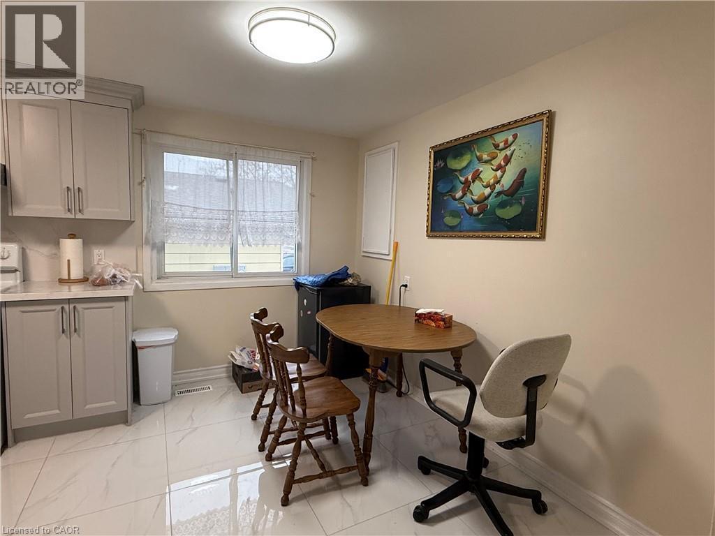 Dining area with baseboards and light marble finish floors - 60 Helene Crescent, Waterloo, ON - Indoor Photo Showing Other Room