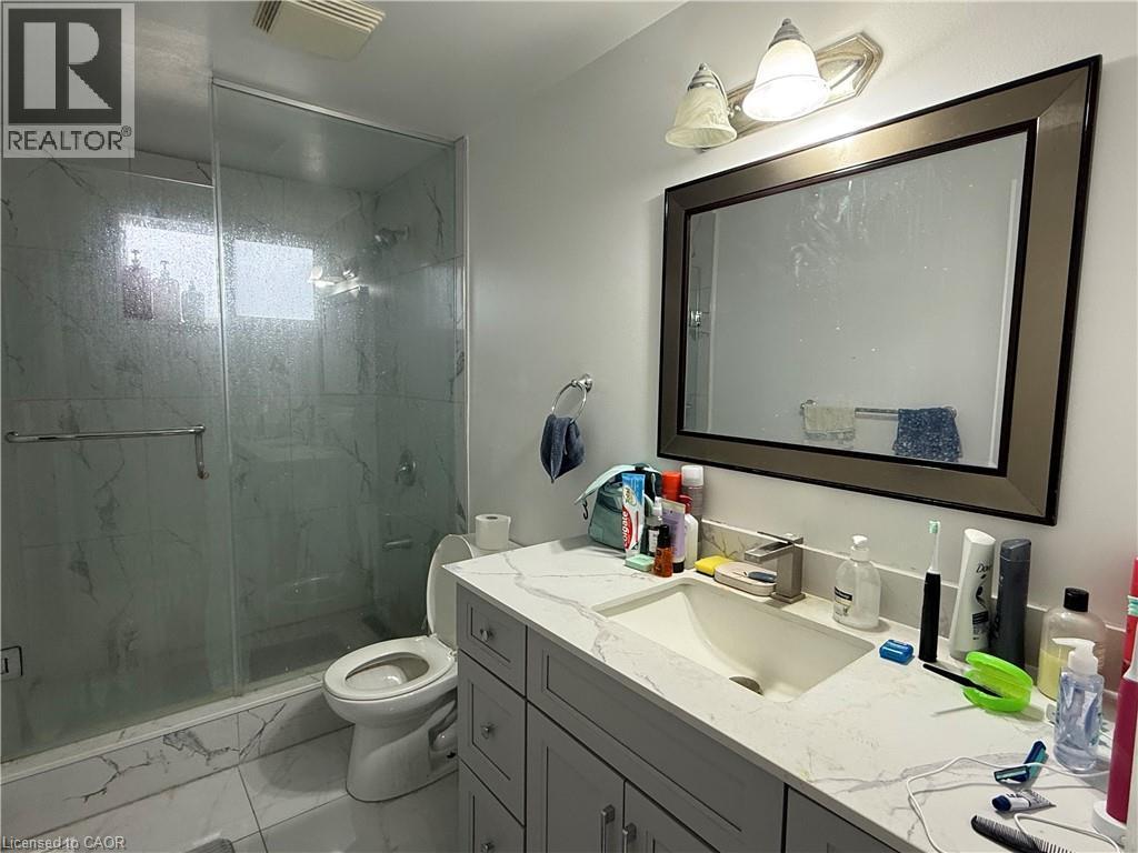 Full bath featuring vanity, a marble finish shower, and light marble finish flooring - 60 Helene Crescent, Waterloo, ON - Indoor Photo Showing Bathroom