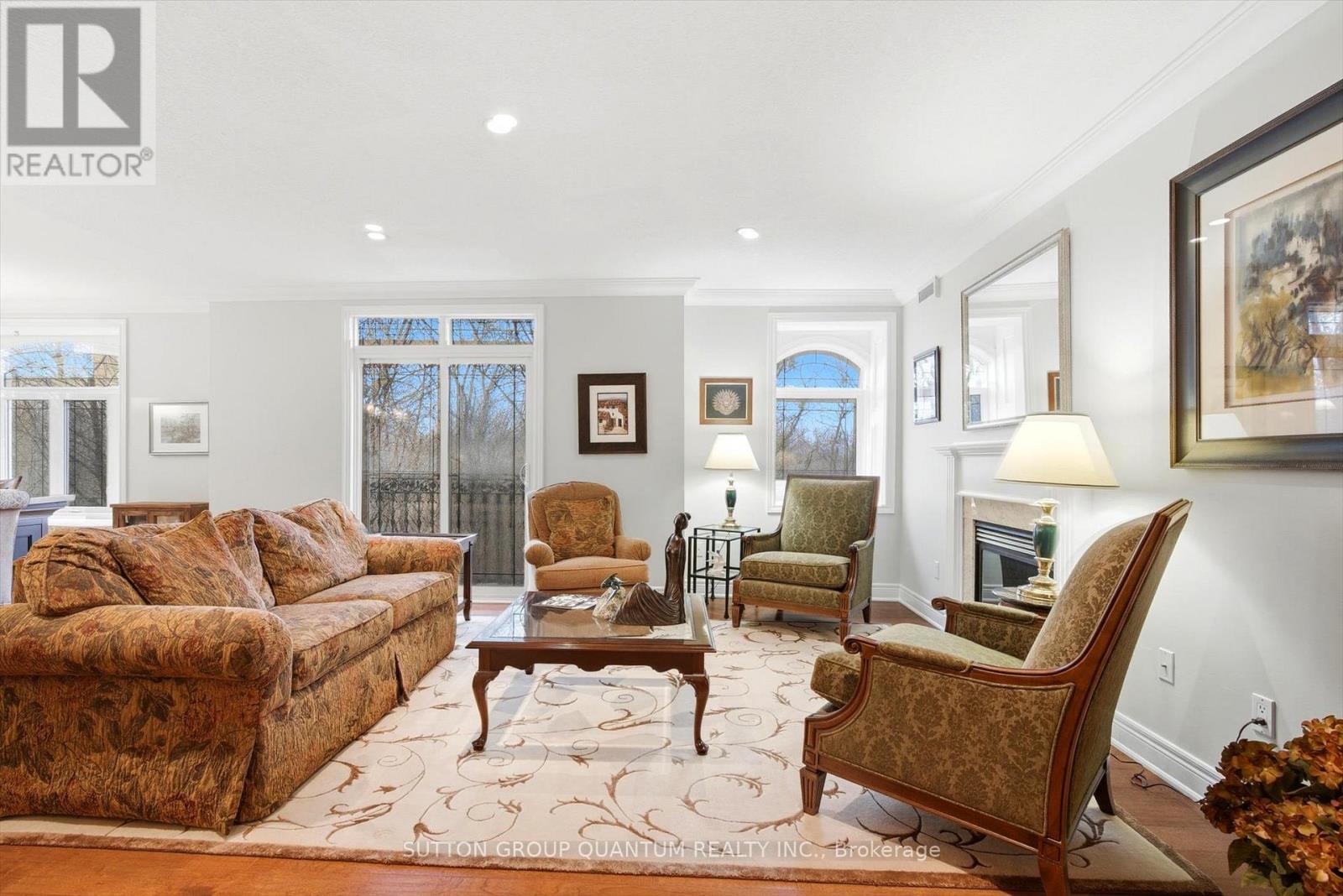 305 - 390 Upper Middle Road E, Oakville, ON - Indoor Photo Showing Living Room With Fireplace