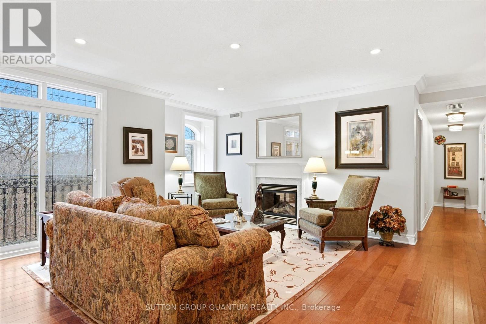 305 - 390 Upper Middle Road E, Oakville, ON - Indoor Photo Showing Living Room With Fireplace