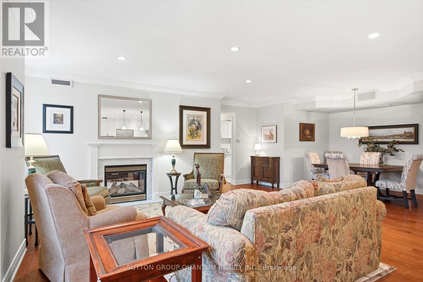 305 - 390 Upper Middle Road E, Oakville, ON - Indoor Photo Showing Living Room With Fireplace