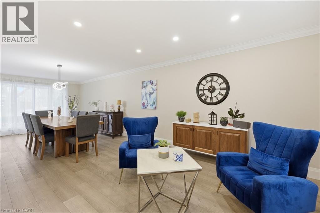 Living area featuring crown molding, light wood-style floors, and recessed lighting - 273 Bryant Crescent, Burlington, ON - Indoor