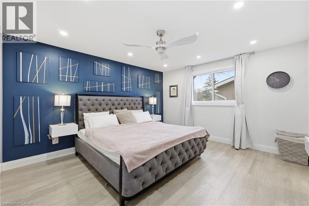 Bedroom featuring a ceiling fan, light wood-type flooring, and recessed lighting - 273 Bryant Crescent, Burlington, ON - Indoor Photo Showing Bedroom
