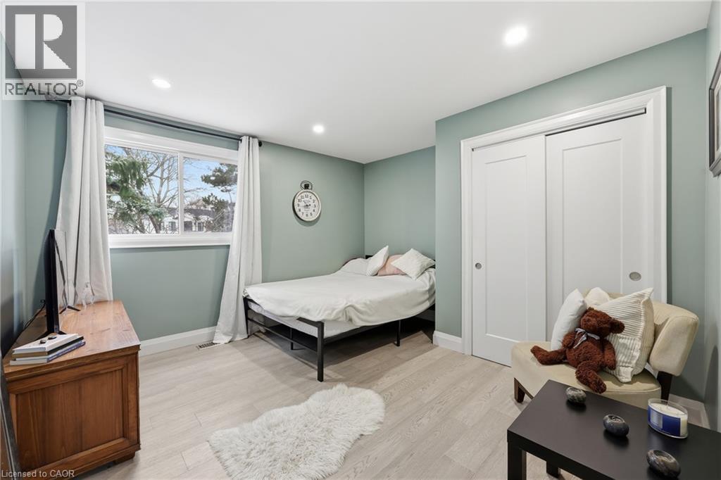 Bedroom with light wood-style flooring, a closet, and recessed lighting - 273 Bryant Crescent, Burlington, ON - Indoor Photo Showing Bedroom