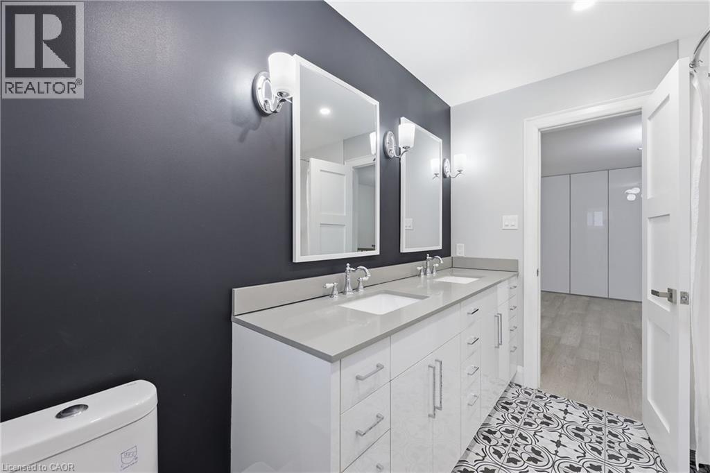 Bathroom with double vanity and light tile patterned floors - 273 Bryant Crescent, Burlington, ON - Indoor Photo Showing Bathroom