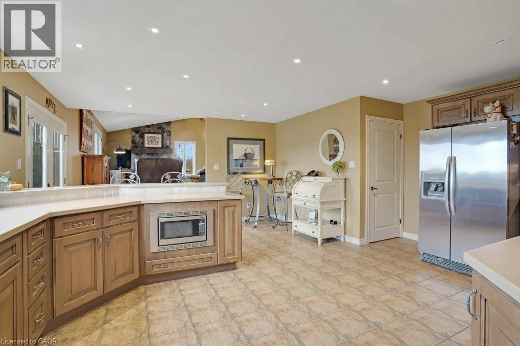 Kitchen with stainless steel appliances, wood finish cabinetry, recessed lighting, and open floor plan - 5511 Second Line, Erin, ON - Indoor Photo Showing Kitchen