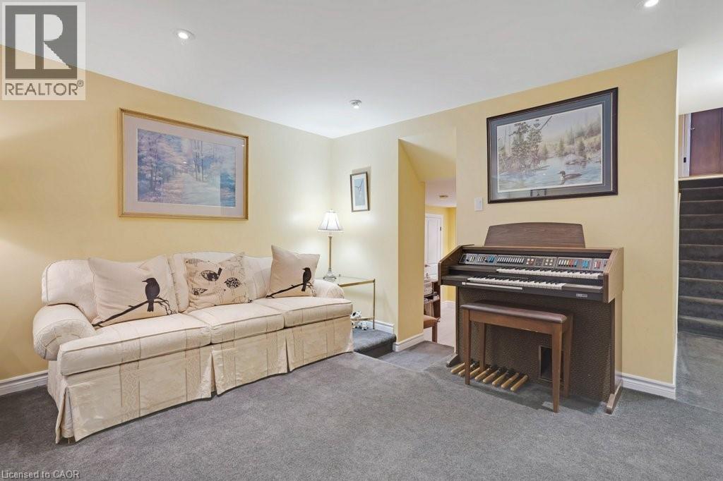 Carpeted living room with baseboards and recessed lighting - 5511 Second Line, Erin, ON - Indoor Photo Showing Living Room With Fireplace