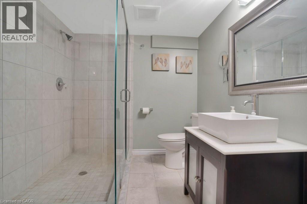 Full bath with vanity, a shower stall, and light tile patterned floors - 5511 Second Line, Erin, ON - Indoor Photo Showing Bathroom