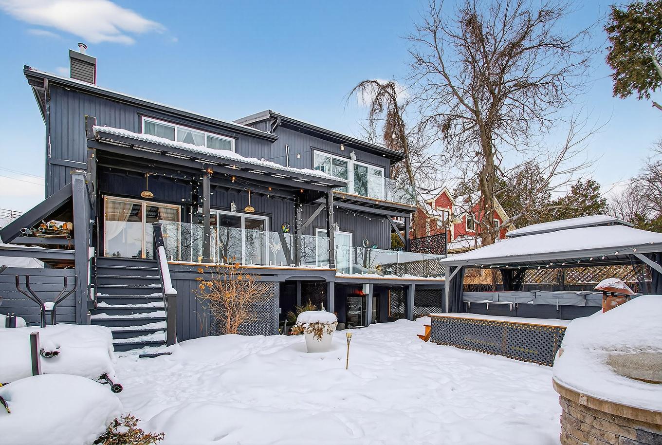 Face arrière - 14871 Boul. Gouin O., Montréal (L'Île-Bizard/Sainte-Geneviève), QC - Outdoor With Deck Patio Veranda