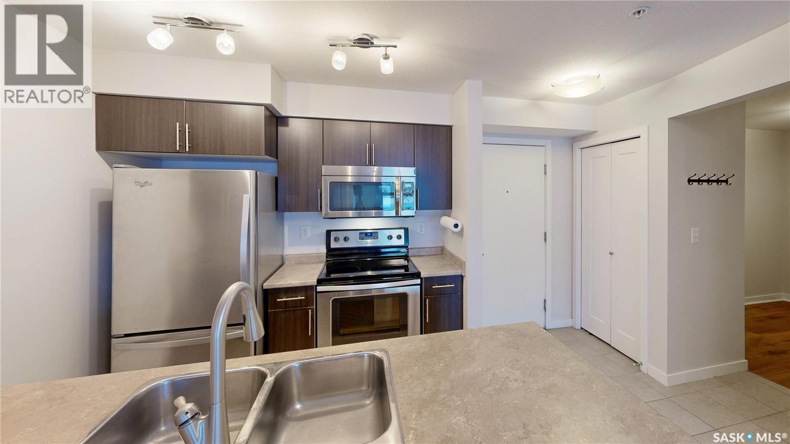 2115 5500 Mitchinson Way, Regina, SK - Indoor Photo Showing Kitchen With Stainless Steel Kitchen With Double Sink