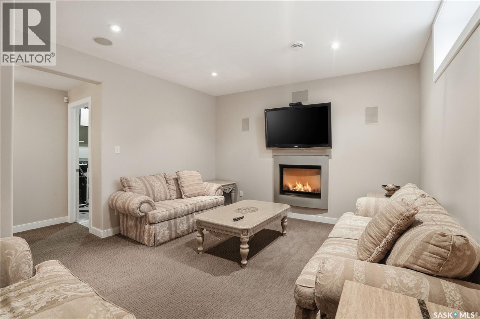 215 Beechwood Crescent, Saskatoon, SK - Indoor Photo Showing Living Room With Fireplace