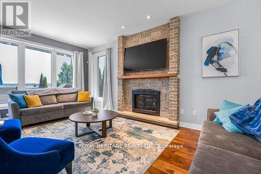 34 Hills Road, Kawartha Lakes (Bobcaygeon), ON - Indoor Photo Showing Living Room With Fireplace