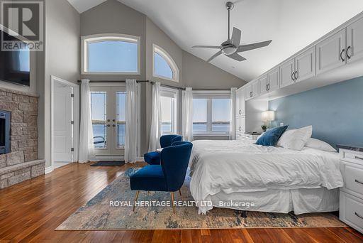 34 Hills Road, Kawartha Lakes (Bobcaygeon), ON - Indoor Photo Showing Bedroom With Fireplace