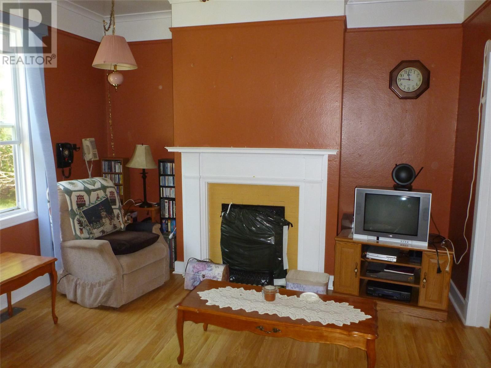 15 Loop Road, Terra Nova, NL - Indoor Photo Showing Living Room With Fireplace