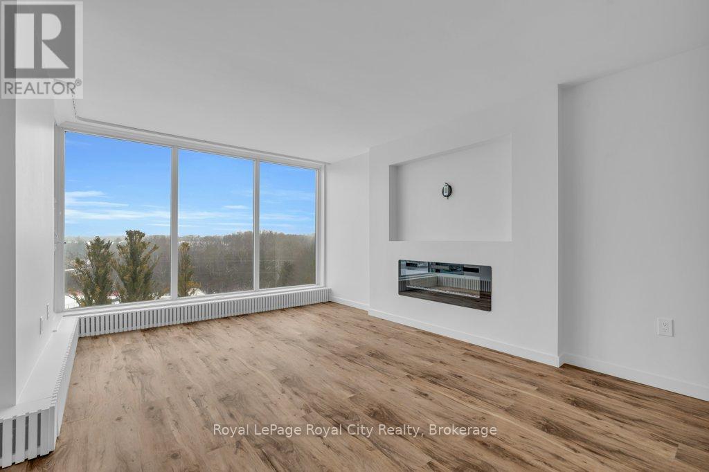 511 - 19 Woodlawn Road E, Guelph (Riverside Park), ON - Indoor Photo Showing Living Room With Fireplace