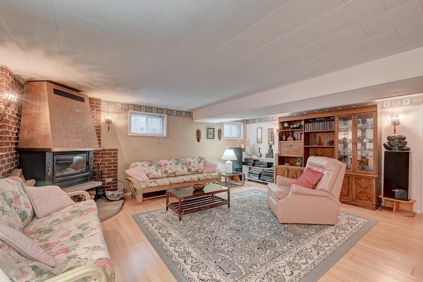 Family room - 795 Place Valiquette, Brossard, QC - Indoor Photo Showing Living Room With Fireplace