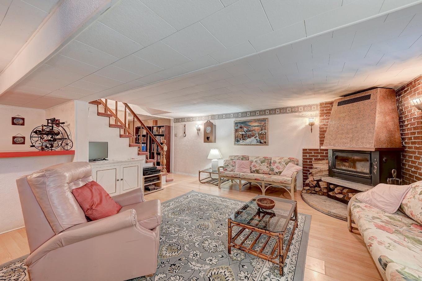 Family room - 795 Place Valiquette, Brossard, QC - Indoor Photo Showing Living Room With Fireplace