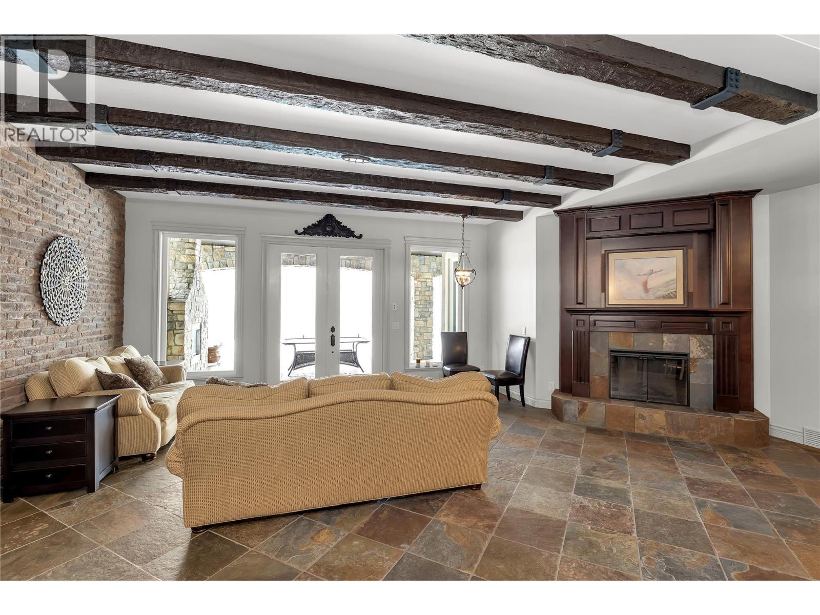 714 Kuipers Crescent, Kelowna, BC - Indoor Photo Showing Living Room With Fireplace