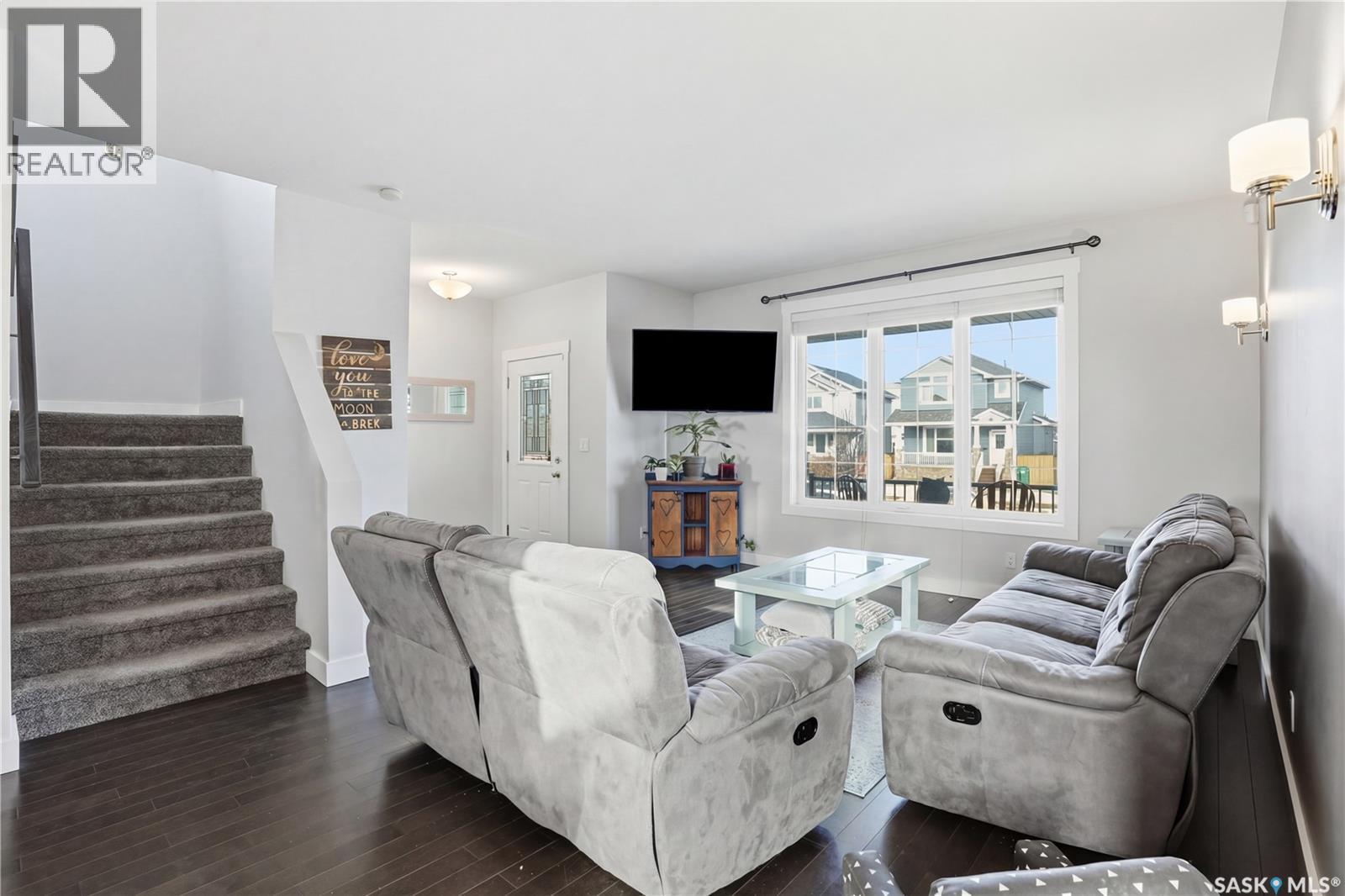 338 Rosewood Boulevard W, Saskatoon, SK - Indoor Photo Showing Living Room With Fireplace