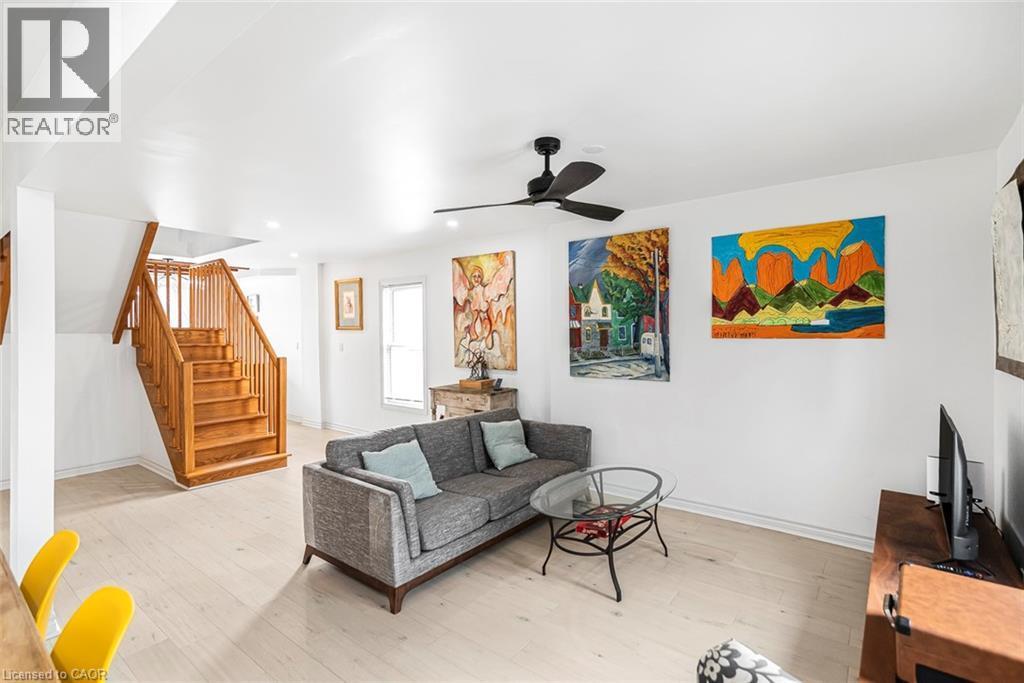 Living room with ceiling fan, light wood finished floors, and recessed lighting - 57 New Street, Hamilton, ON - Indoor Photo Showing Living Room