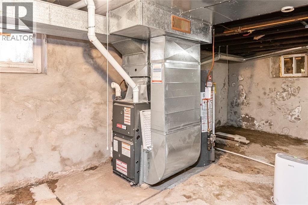 Utilities with heating unit and water heater - 57 New Street, Hamilton, ON - Indoor Photo Showing Basement