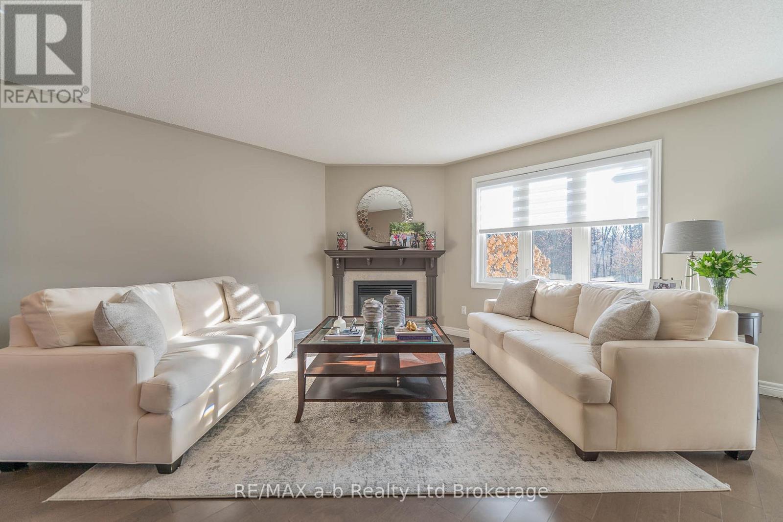 Living Room - 90 Weston Drive, Tillsonburg, ON - Indoor Photo Showing Living Room With Fireplace