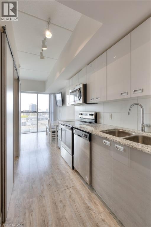 257 Hemlock Street Unit# 607, Waterloo, ON - Indoor Photo Showing Kitchen With Double Sink