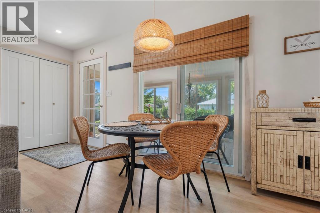 Dining room featuring wood finished floors and recessed lighting - 181 Cedar Drive, Turkey Point, ON - Indoor Photo Showing Dining Room