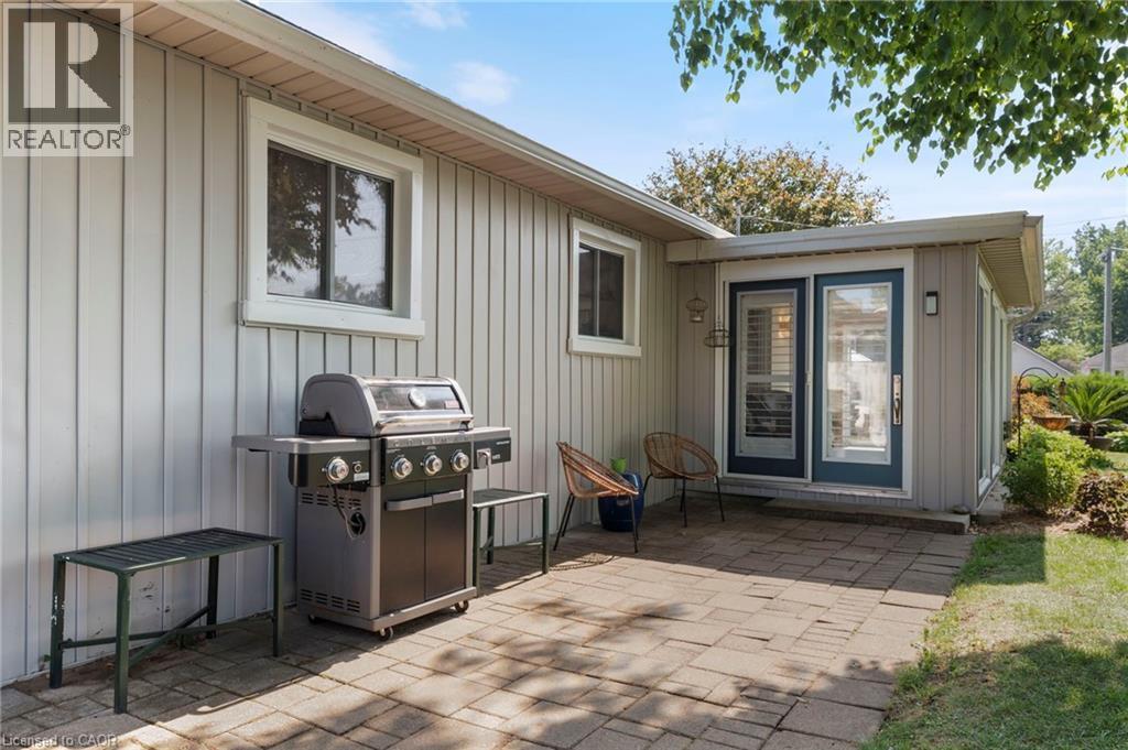 View of patio with a grill - 181 Cedar Drive, Turkey Point, ON - Outdoor With Exterior
