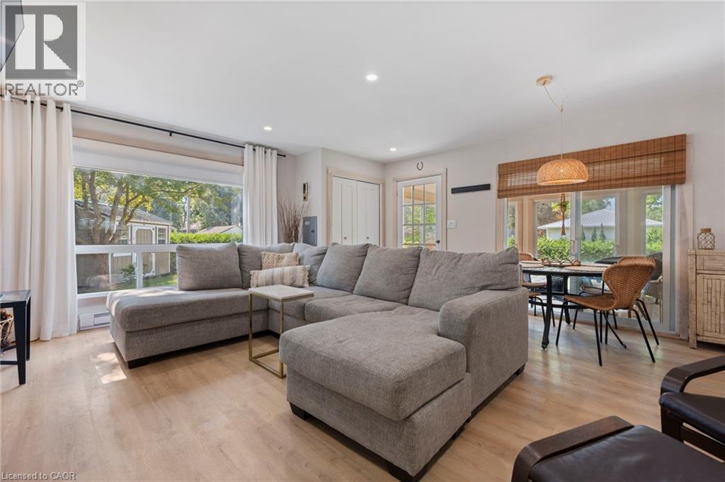 Living area featuring plenty of natural light, light wood-type flooring, and recessed lighting - 181 Cedar Drive, Turkey Point, ON - Indoor Photo Showing Living Room