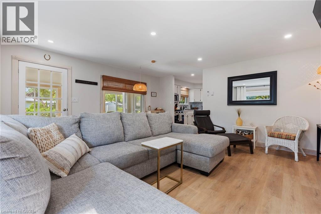 Living room featuring recessed lighting and light wood-style flooring - 181 Cedar Drive, Turkey Point, ON - Indoor Photo Showing Living Room
