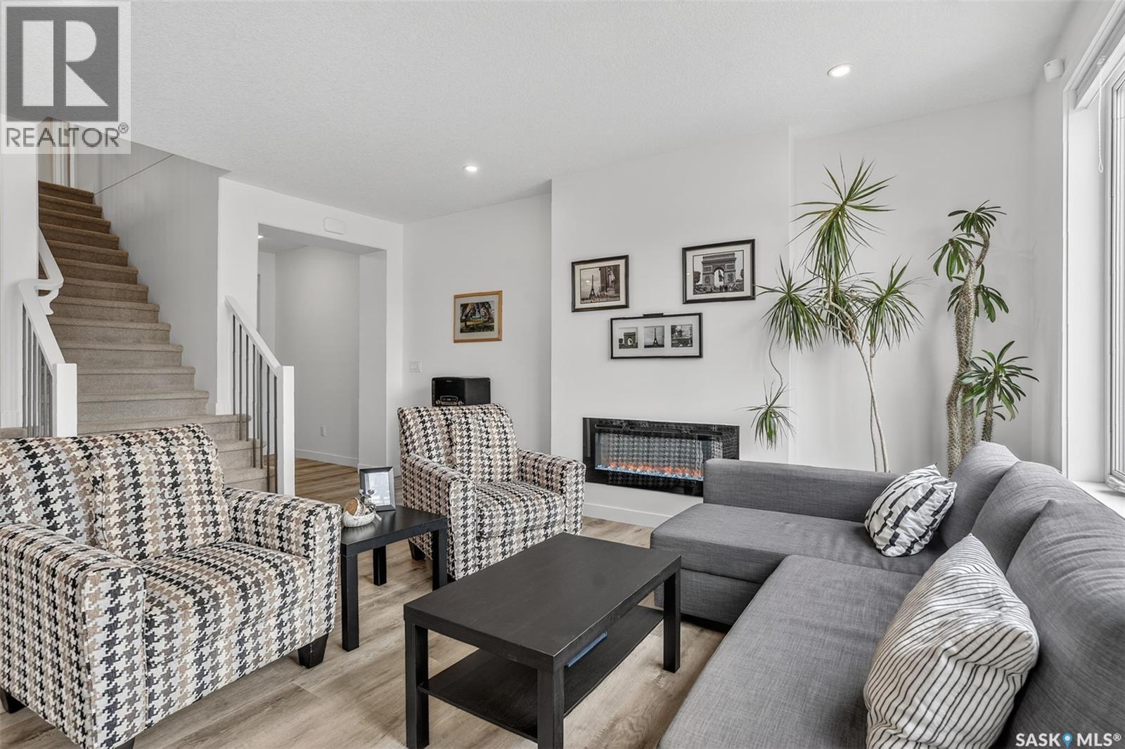 314 Keith Union, Saskatoon, SK - Indoor Photo Showing Living Room With Fireplace