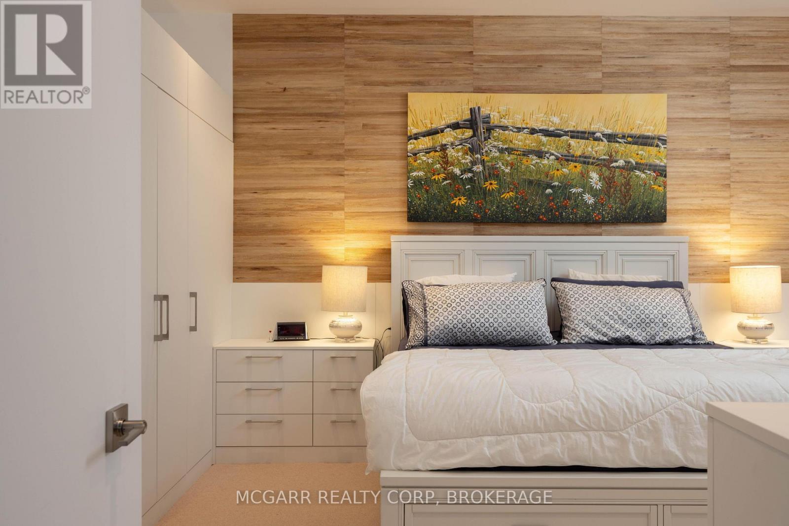 Primary suite - all built in cabinets - 401 - 77 Yates Street, St. Catharines (Downtown), ON - Indoor Photo Showing Bedroom
