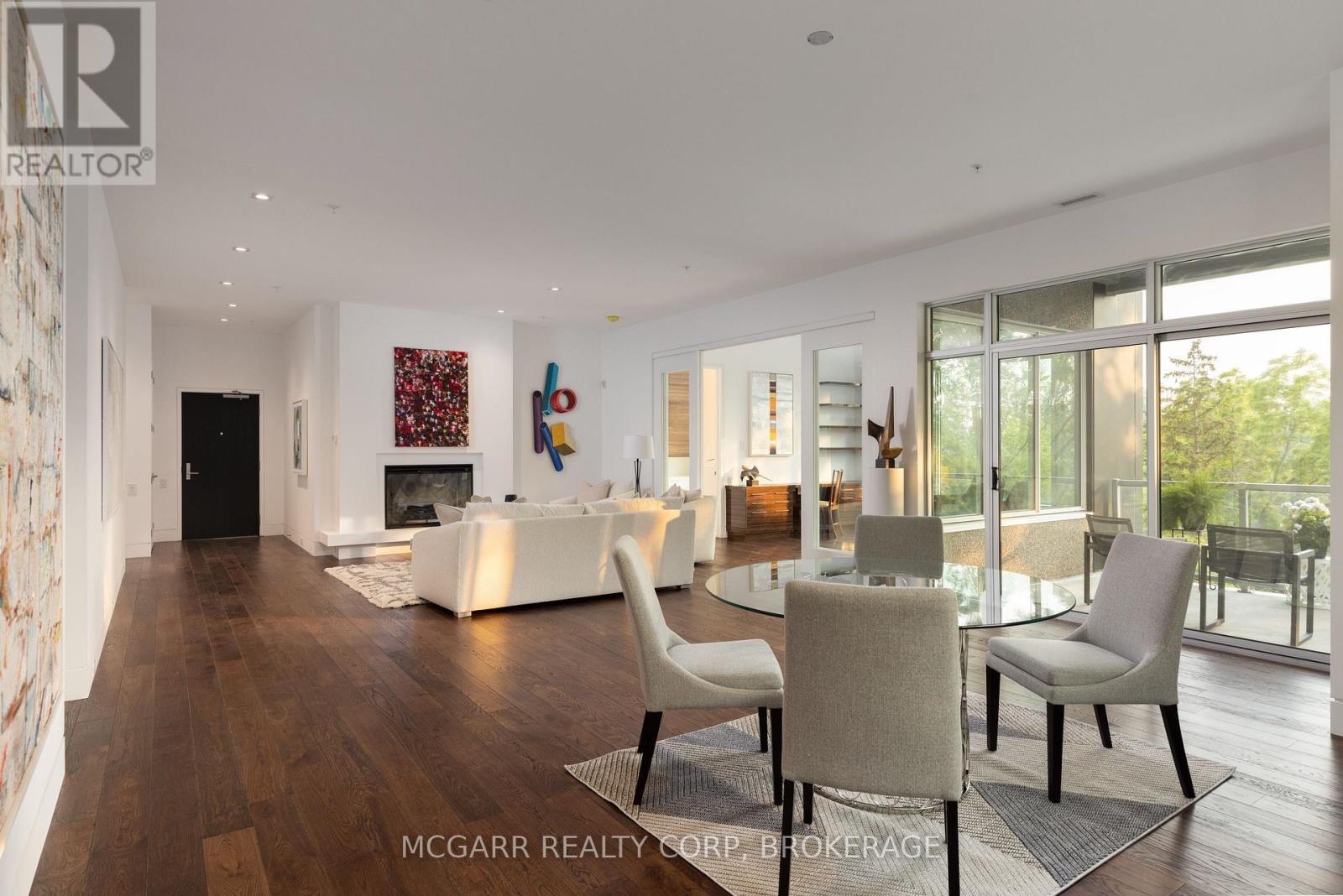 Great room from previous listing - 401 - 77 Yates Street, St. Catharines (Downtown), ON - Indoor With Fireplace