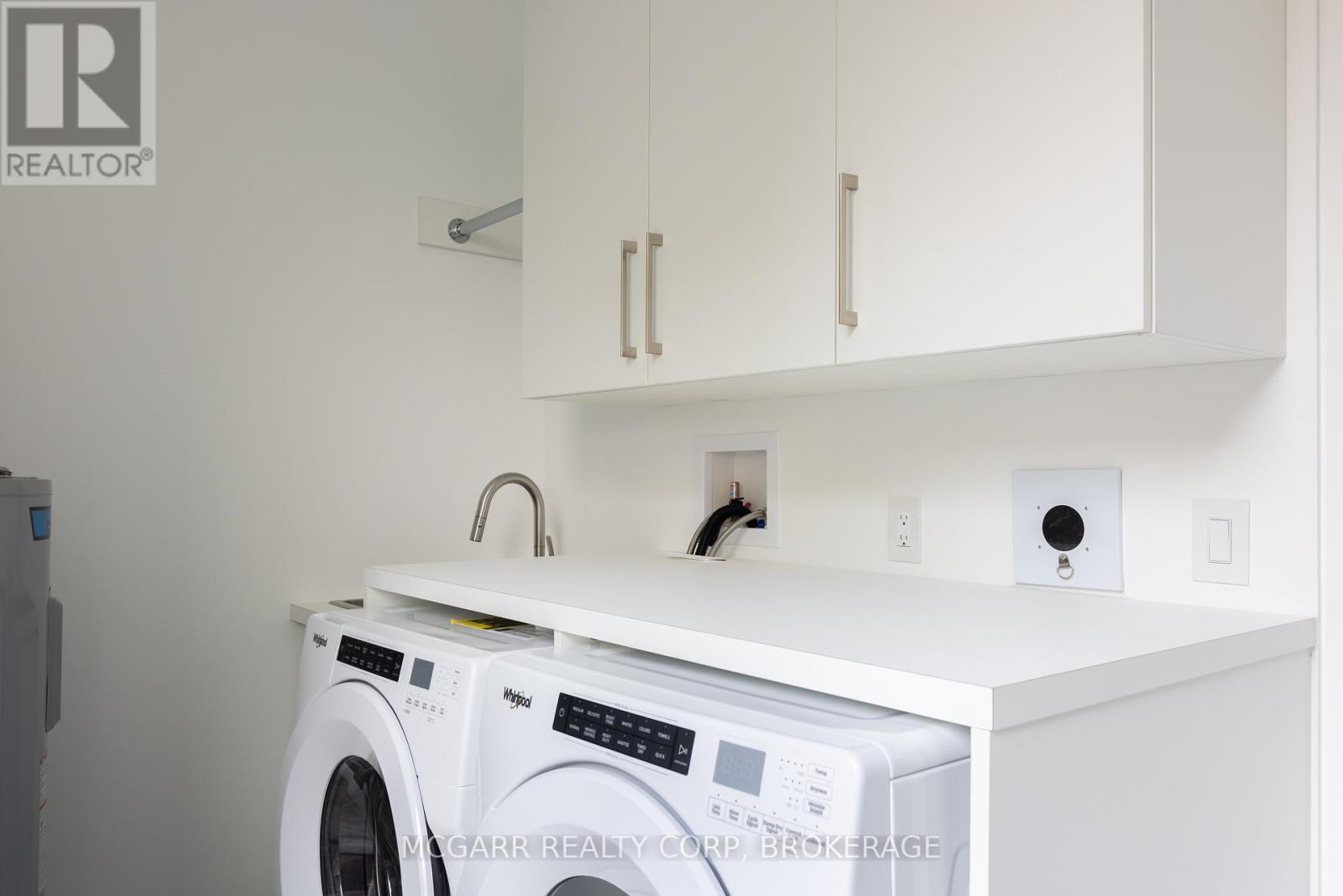 Lundry room with sink + appliances - 401 - 77 Yates Street, St. Catharines (Downtown), ON - Indoor Photo Showing Laundry Room