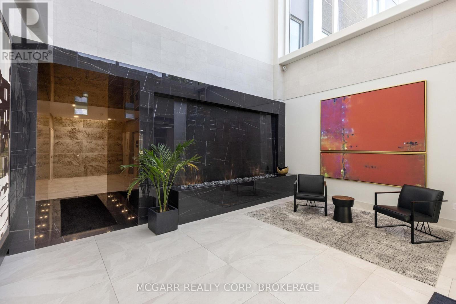 Open lobby with waterfall - 401 - 77 Yates Street, St. Catharines (Downtown), ON - Photo Showing Other Room