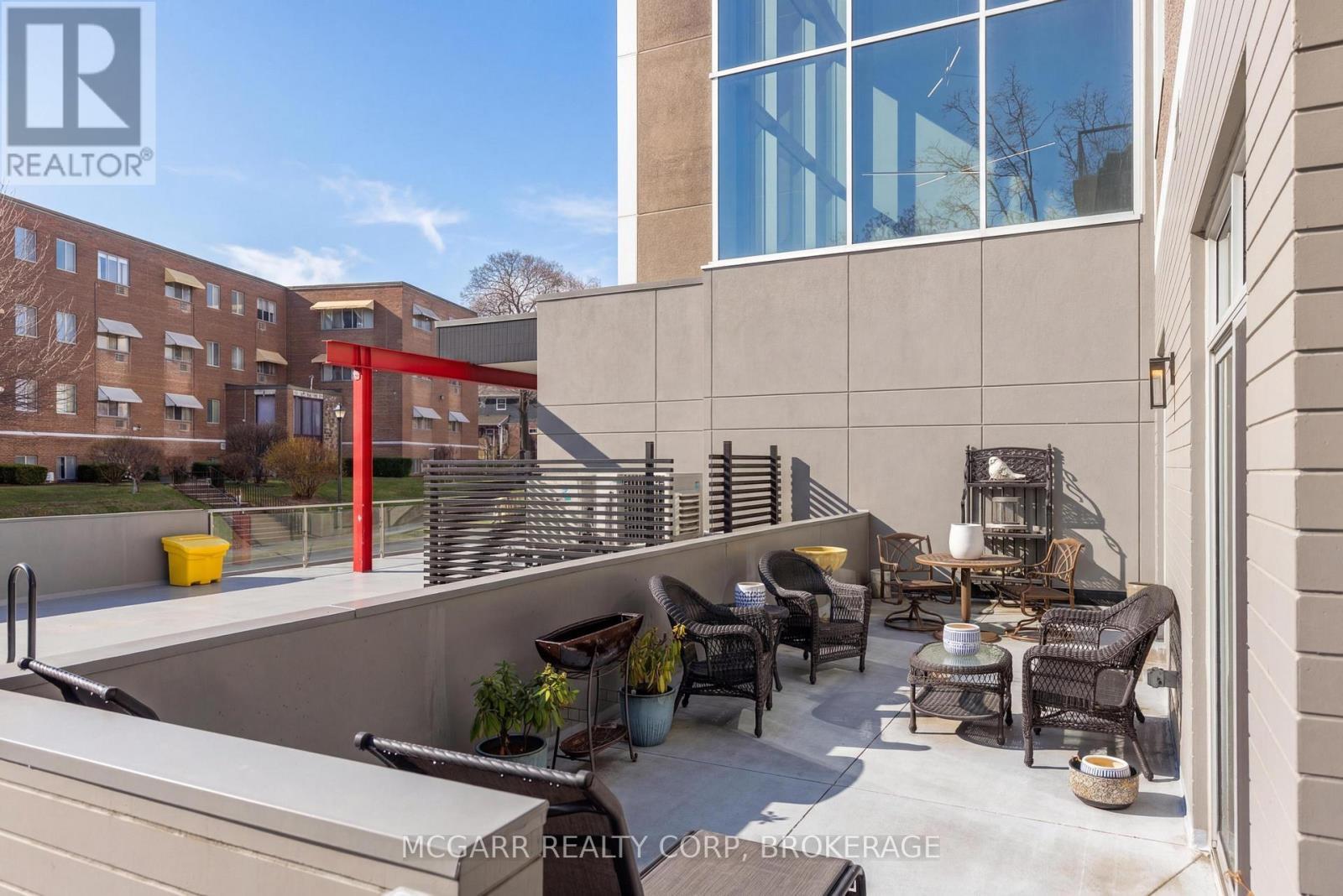Full length entertaining terrace - 401 - 77 Yates Street, St. Catharines (Downtown), ON - Outdoor With Exterior