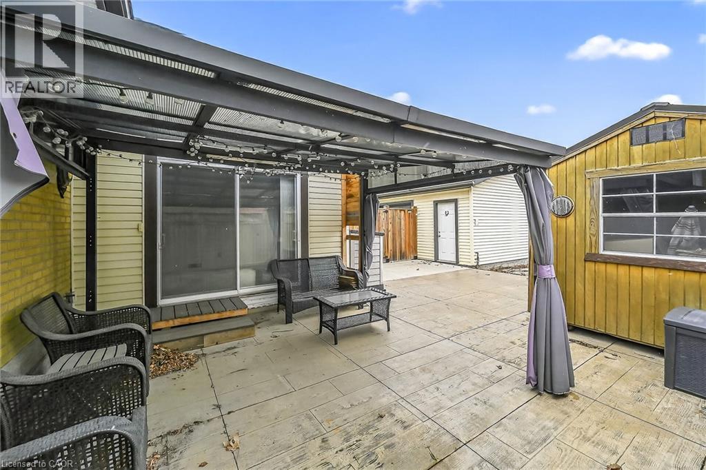 View of patio / terrace featuring a pergola - 19 Burfield Avenue, Hamilton, ON - Outdoor With Exterior