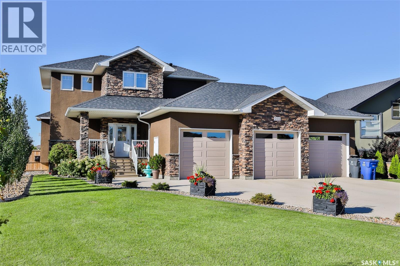 200 Clubhouse Boulevard E, Warman, SK - Outdoor With Deck Patio Veranda With Facade