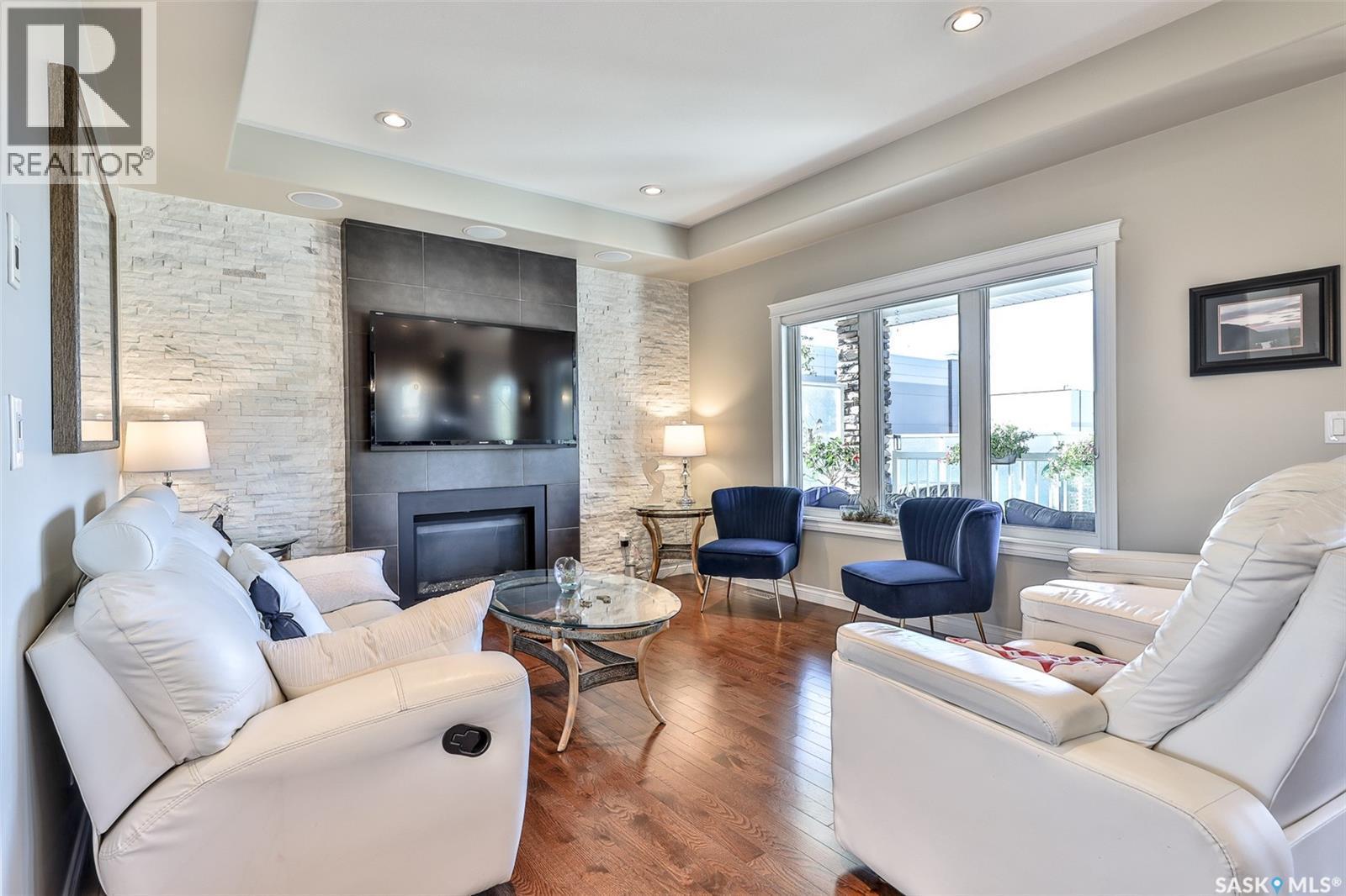 200 Clubhouse Boulevard E, Warman, SK - Indoor Photo Showing Living Room With Fireplace