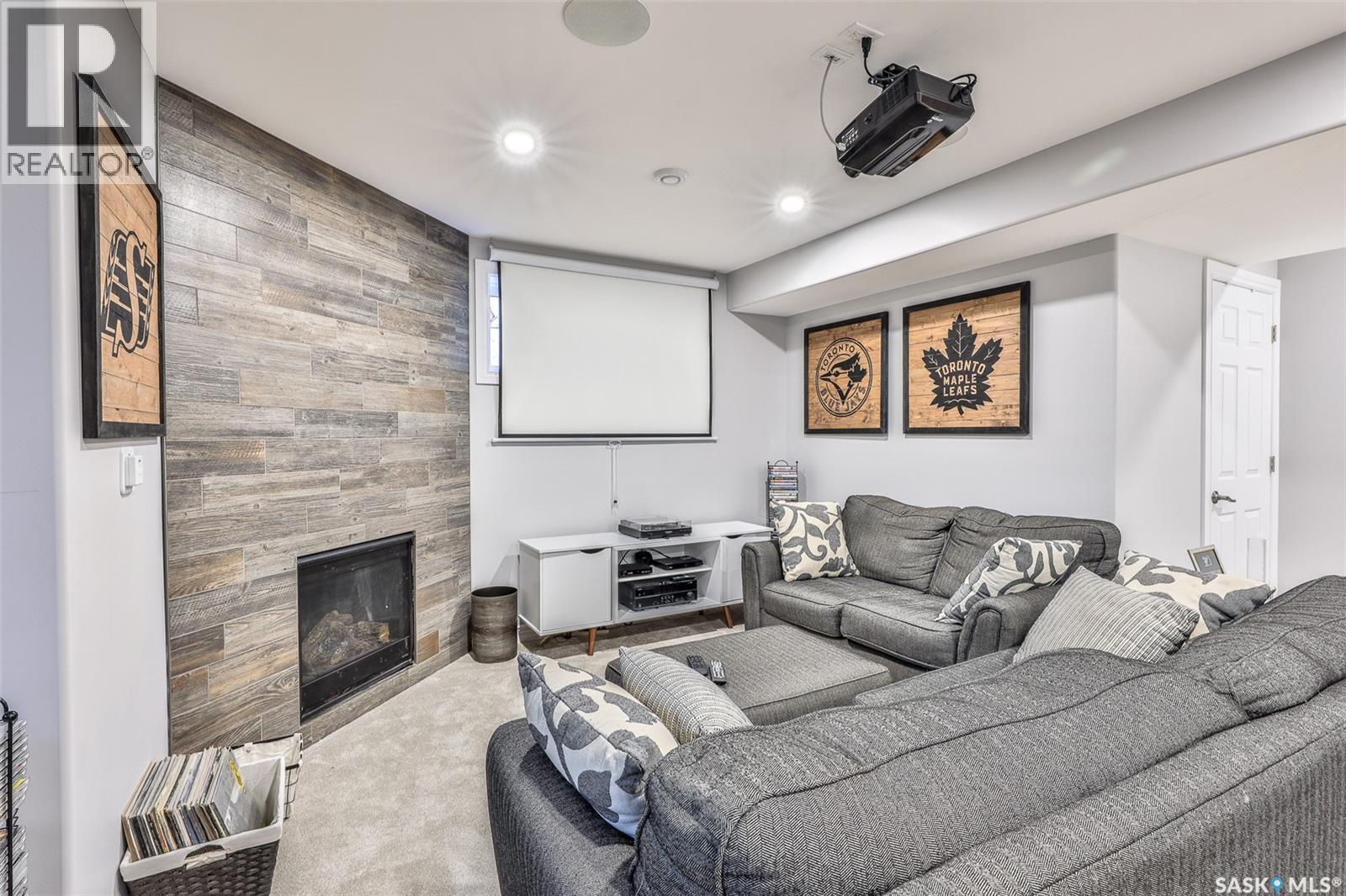 200 Clubhouse Boulevard E, Warman, SK - Indoor Photo Showing Living Room With Fireplace