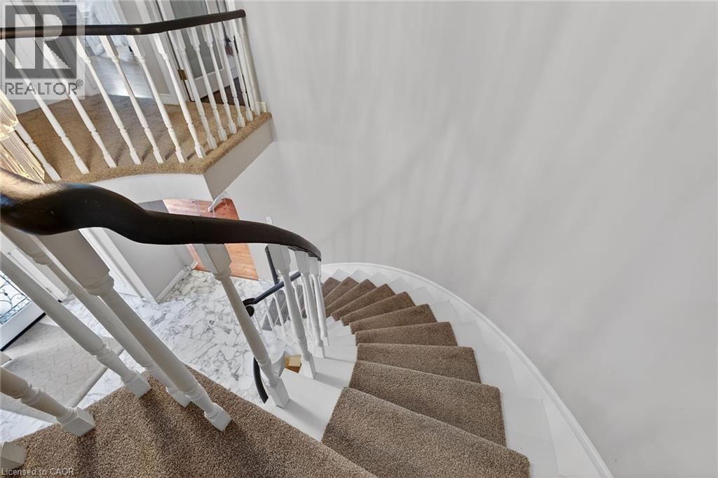 Staircase with baseboards - 22 Woodside Drive, Hamilton, ON - Indoor Photo Showing Other Room