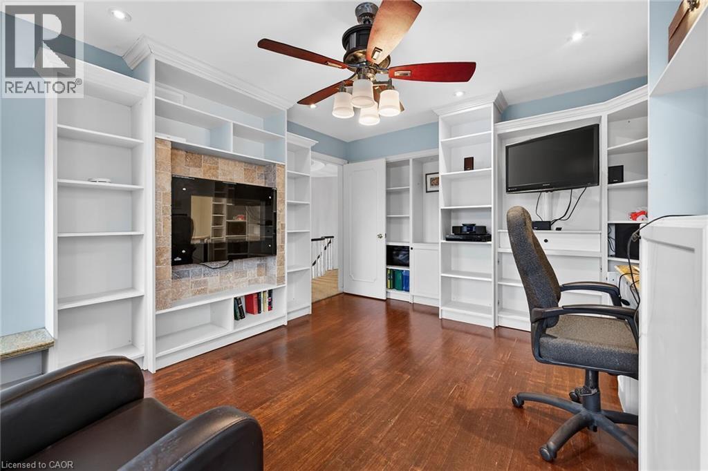 Office area featuring built in features, ceiling fan, and dark wood finished floors - 22 Woodside Drive, Hamilton, ON - Indoor Photo Showing Office