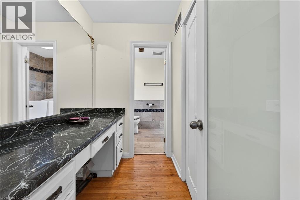 Full bath with vanity and light wood-style flooring - 22 Woodside Drive, Hamilton, ON - Indoor Photo Showing Bathroom