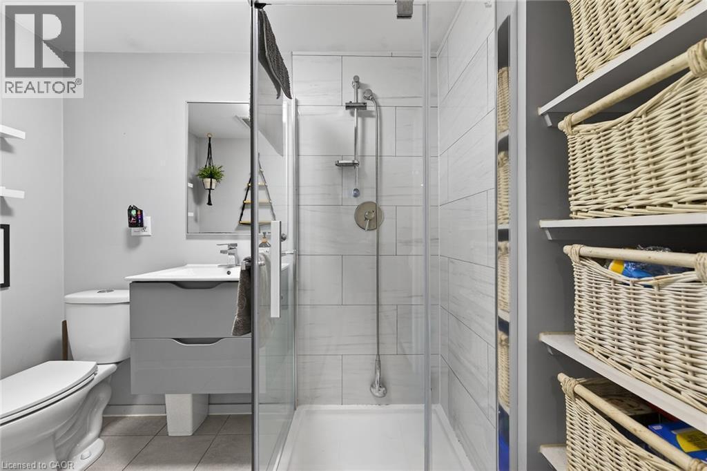 Bathroom with vanity, a shower stall, and light tile patterned floors - 22 Woodside Drive, Hamilton, ON - Indoor Photo Showing Bathroom