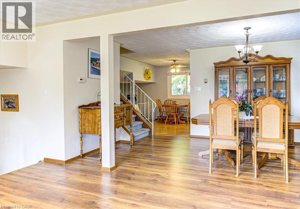 View through the dining area towards the kitchen. - 12 Miller Crescent, Simcoe, ON - Indoor Photo Showing Dining Room